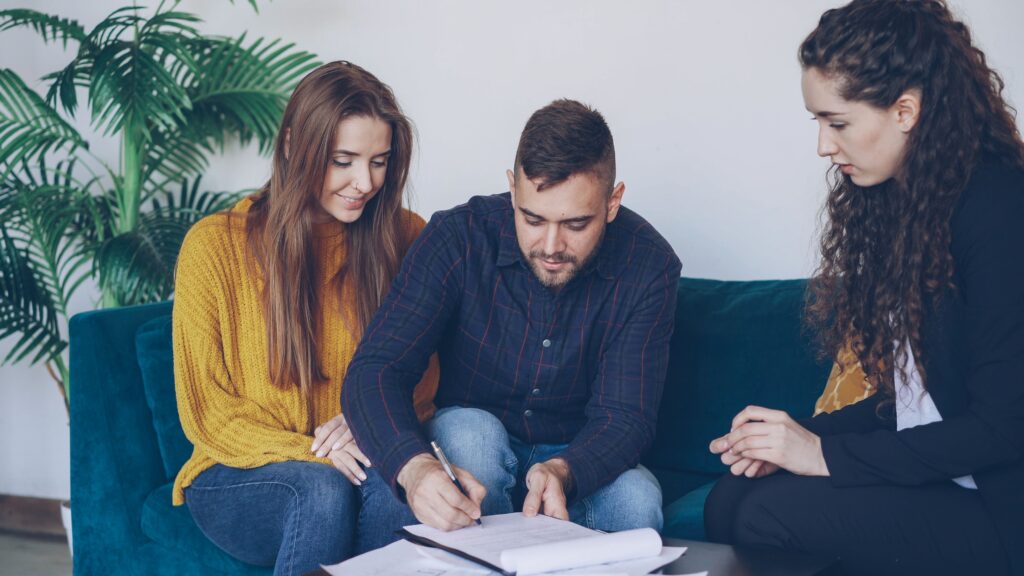 Couple signing a contract